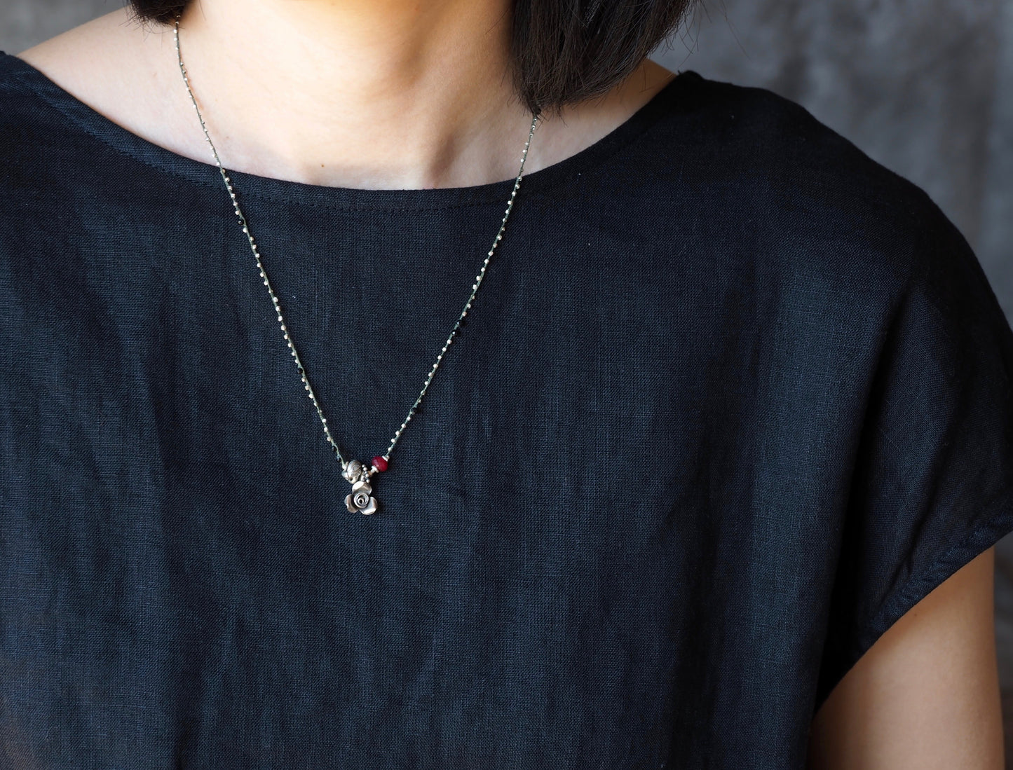 flower and ruby braided pendant