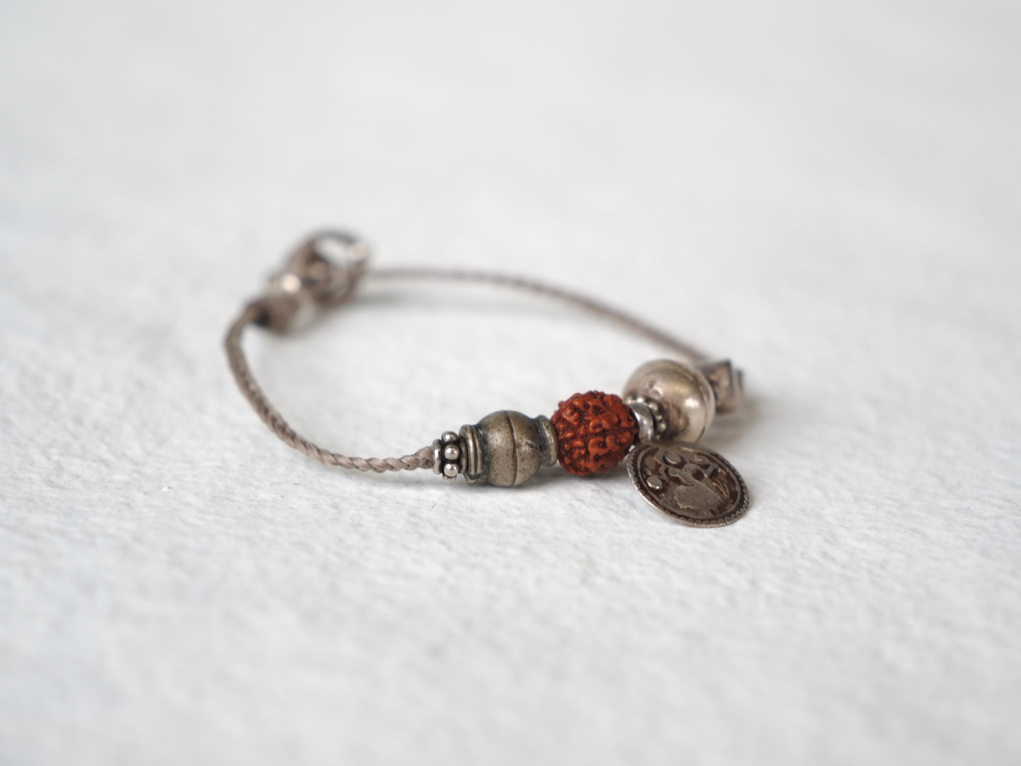 -old india coin- code bracelet