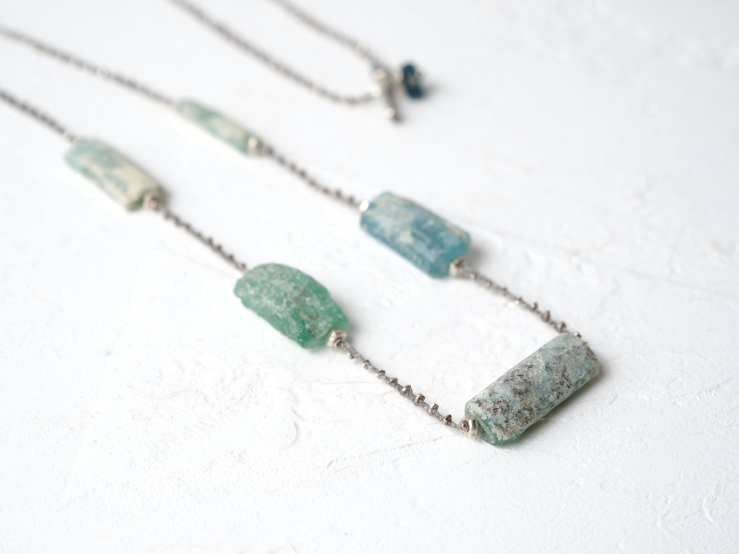 -Roman glass- silver braid