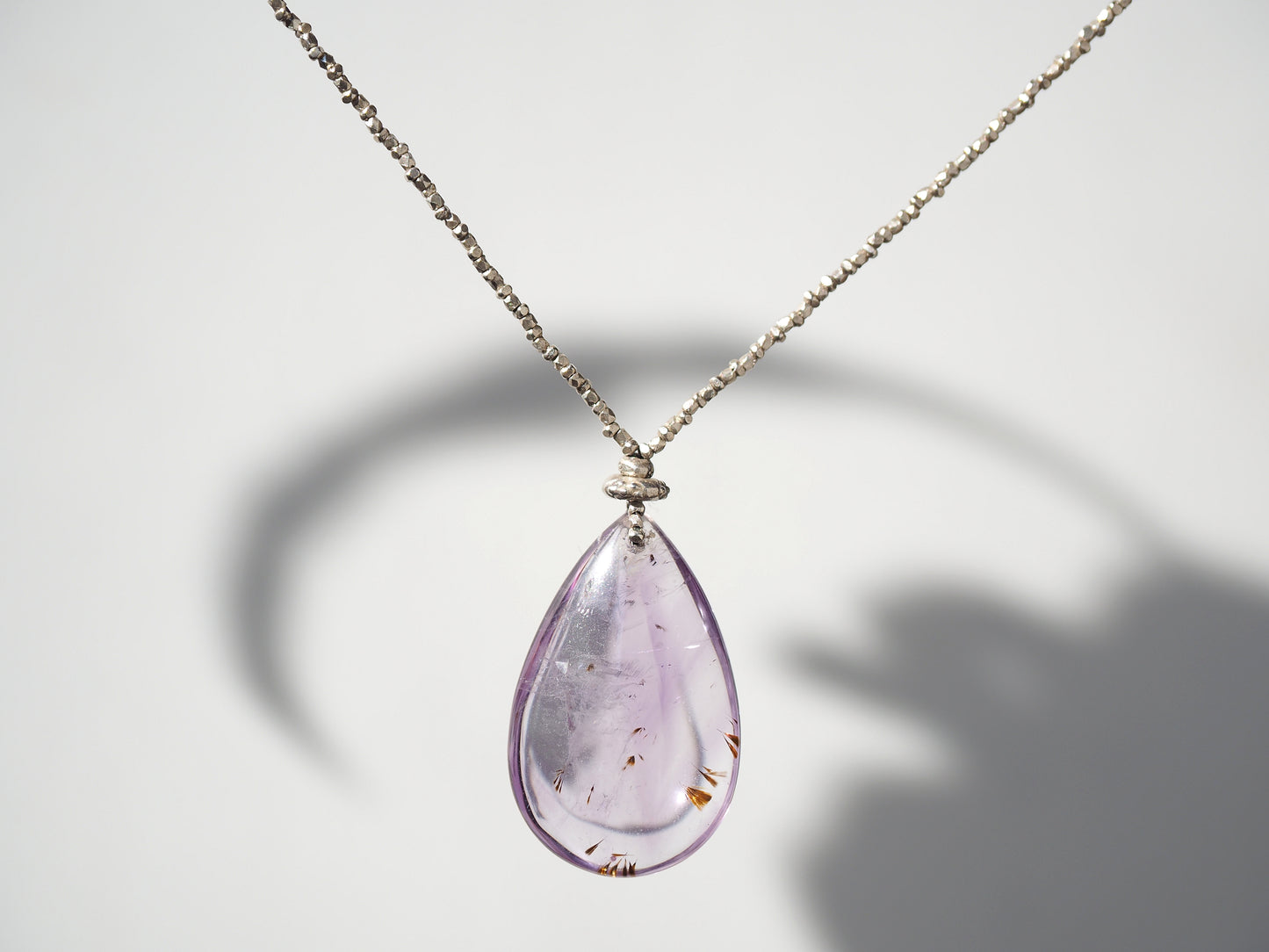 -Cacoxenite in amethyst- silver pendant