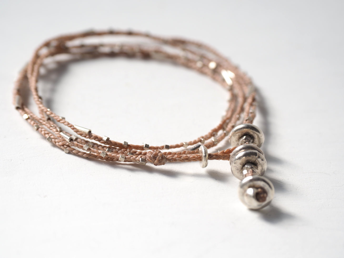 silver braided bracelet beige