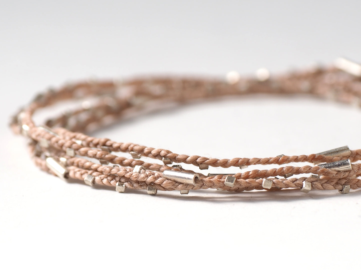 silver braided bracelet beige