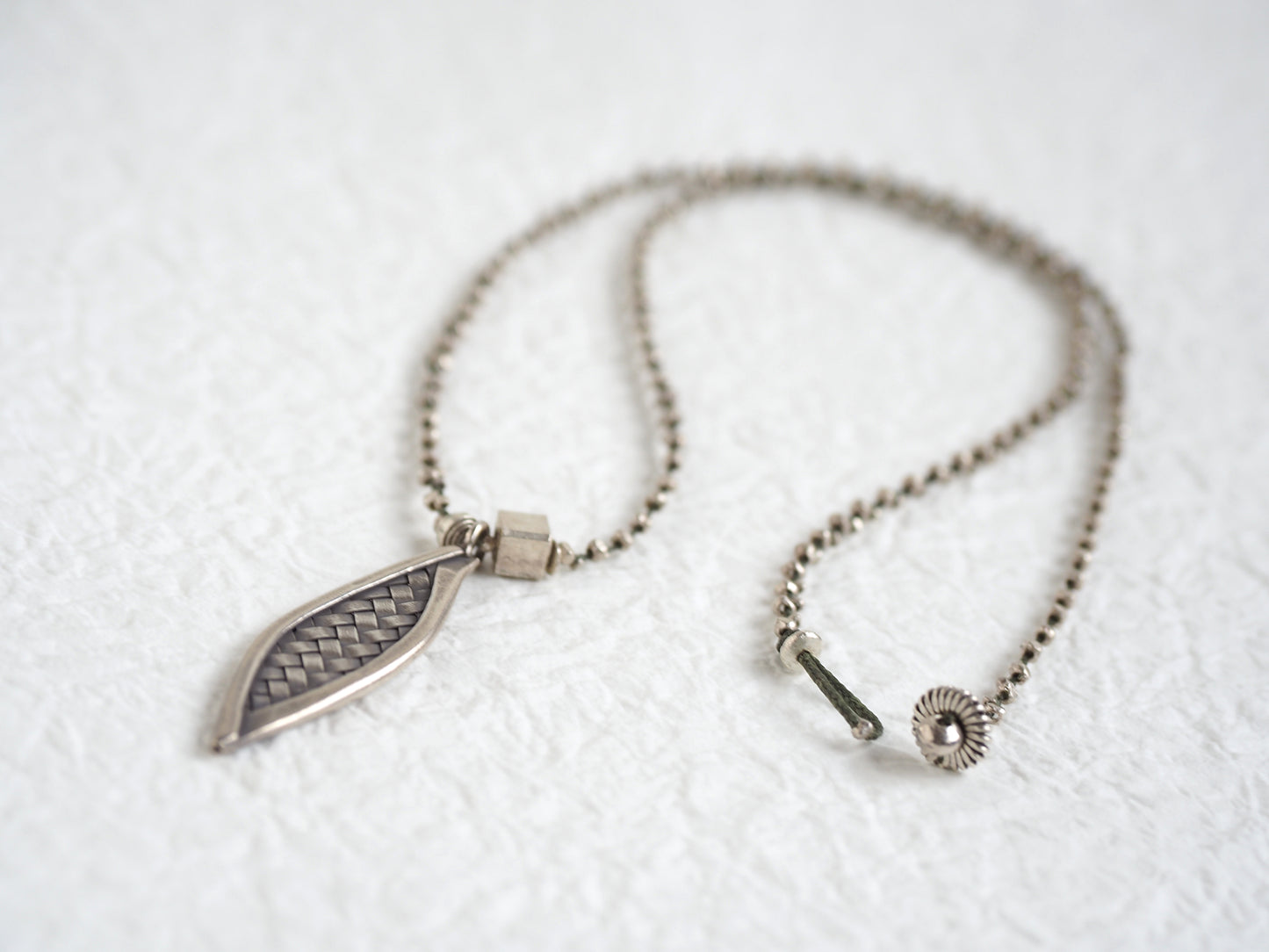 Silver braid pendant "straw knitting"