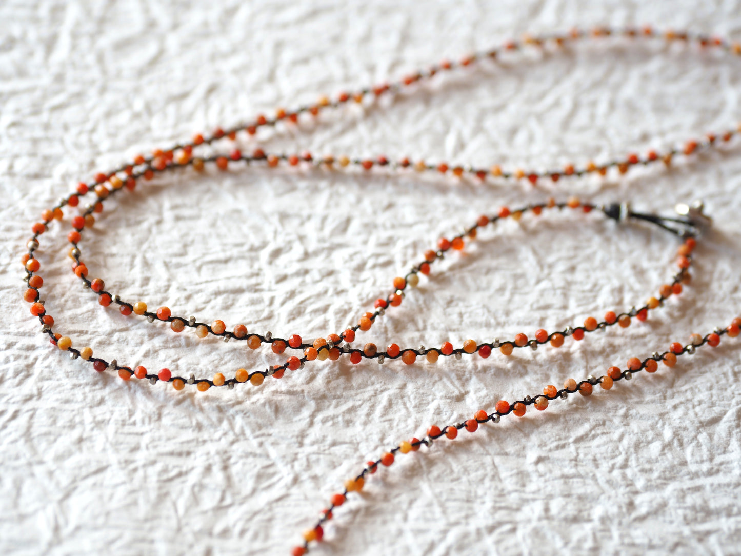 -African coral- braid long pendant