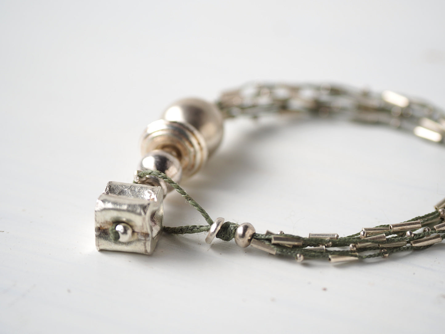 Braided silver six-strand bracelet